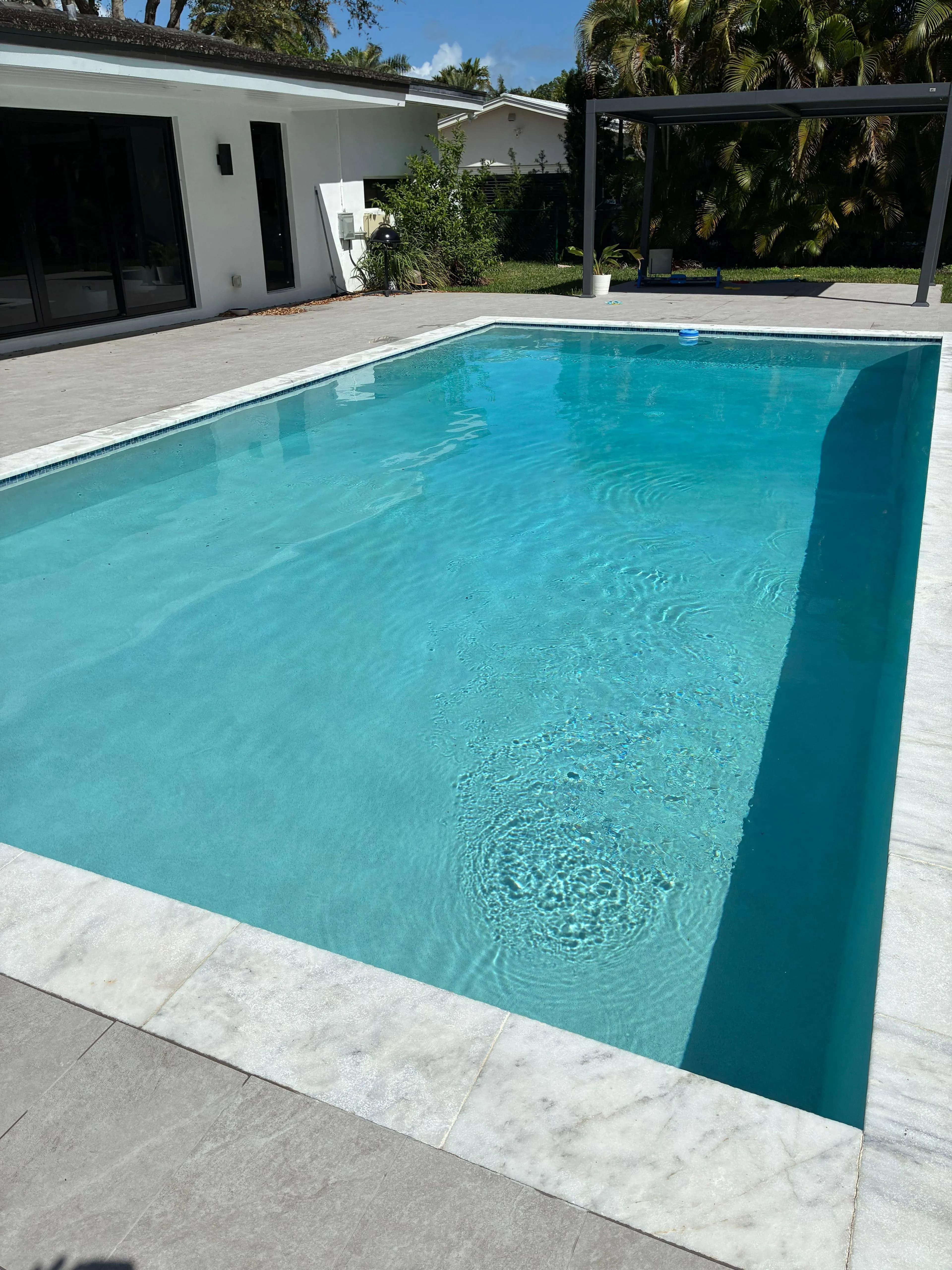 Clean Pool with Travertine Deck