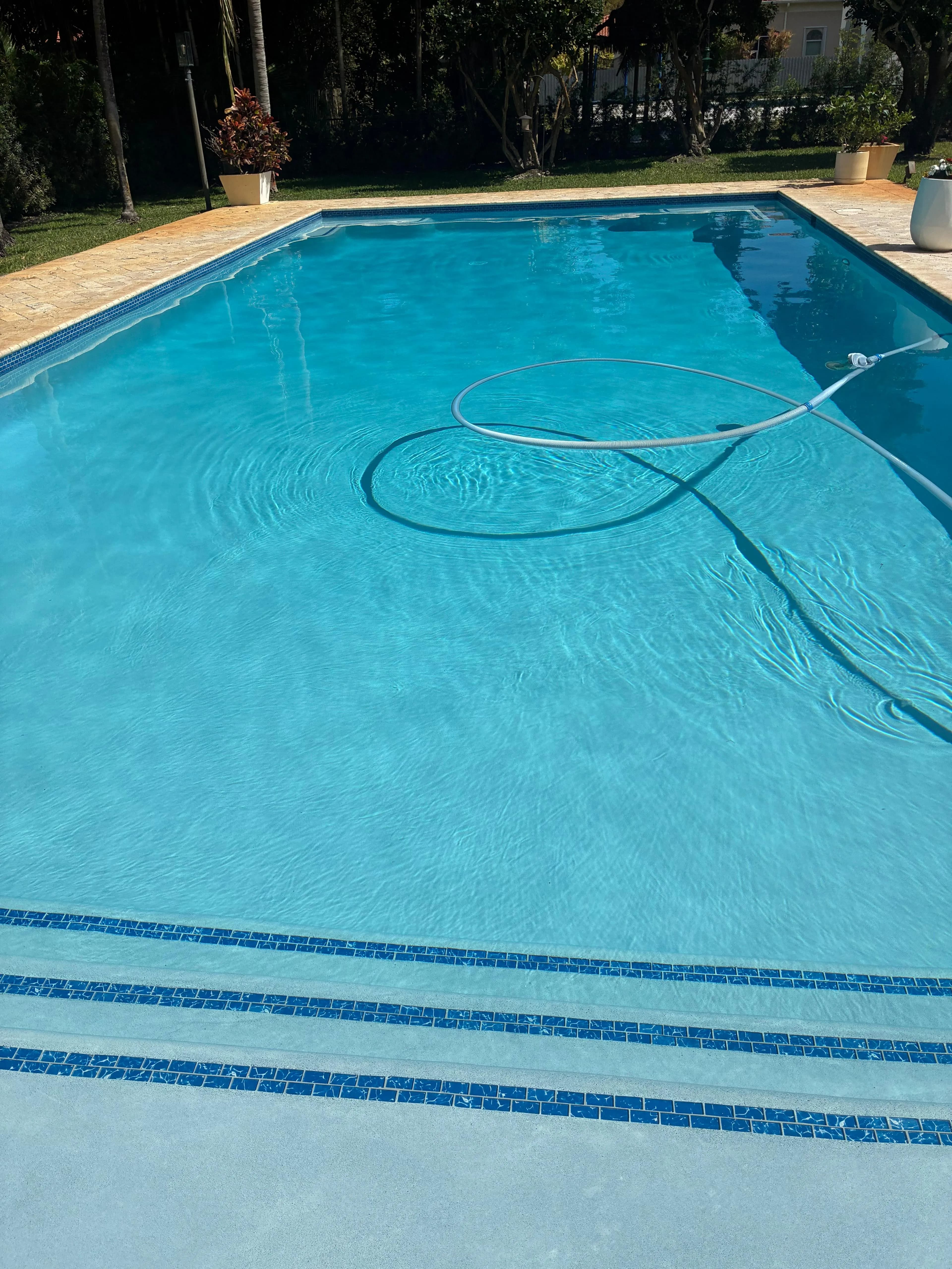 Pool Vacuum Cleaning in Progress